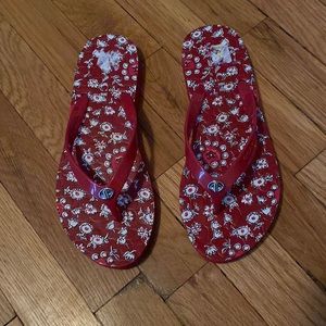 Lightly worn Size 7 Red floral pattern Coach Flip Flops. Great Condition!